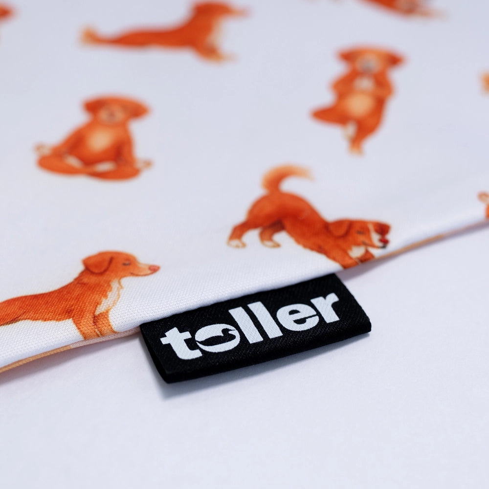 Fabric with dog pattern and 'toller' brand label