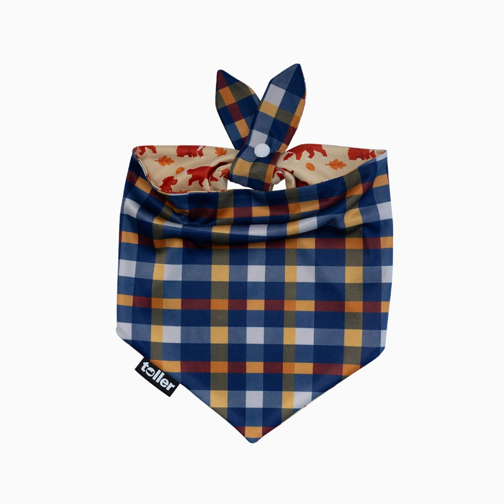 Plaid patterned dog bandana with a visible brand logo on a white background