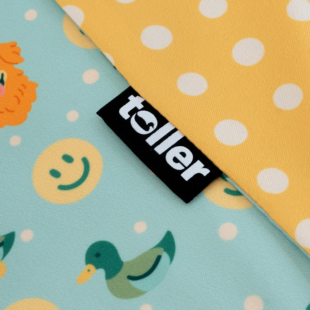 Fabric with cartoon designs and a 'toller' label