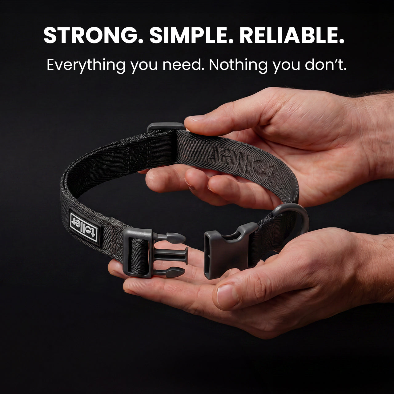 Black dog collar held in hands with brand name on a black background