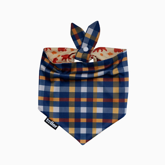 Plaid patterned dog bandana with a visible brand logo on a white background