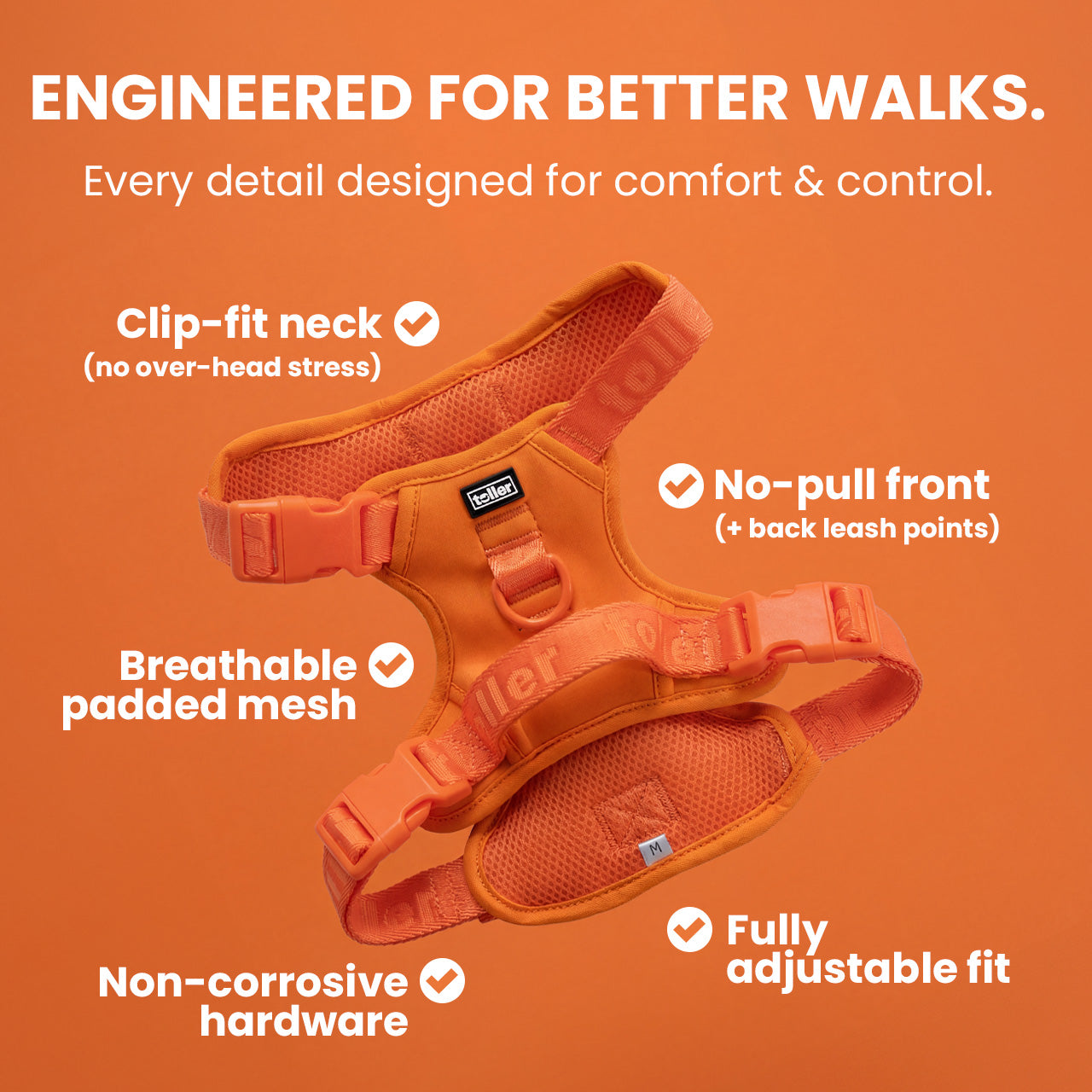 Orange dog harness on an orange background with features highlighted.