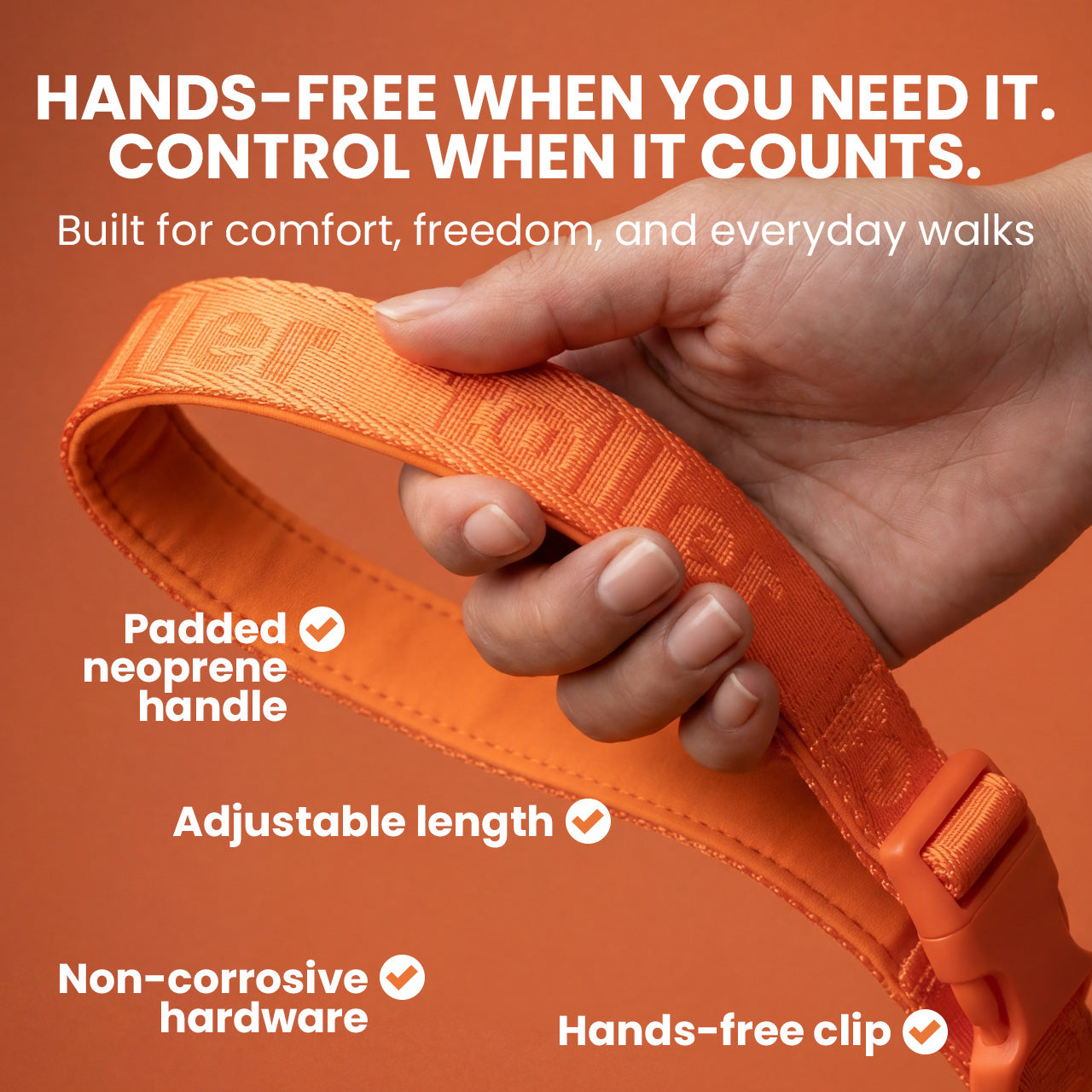 Orange dog leash held by a hand with text highlighting features on an orange background