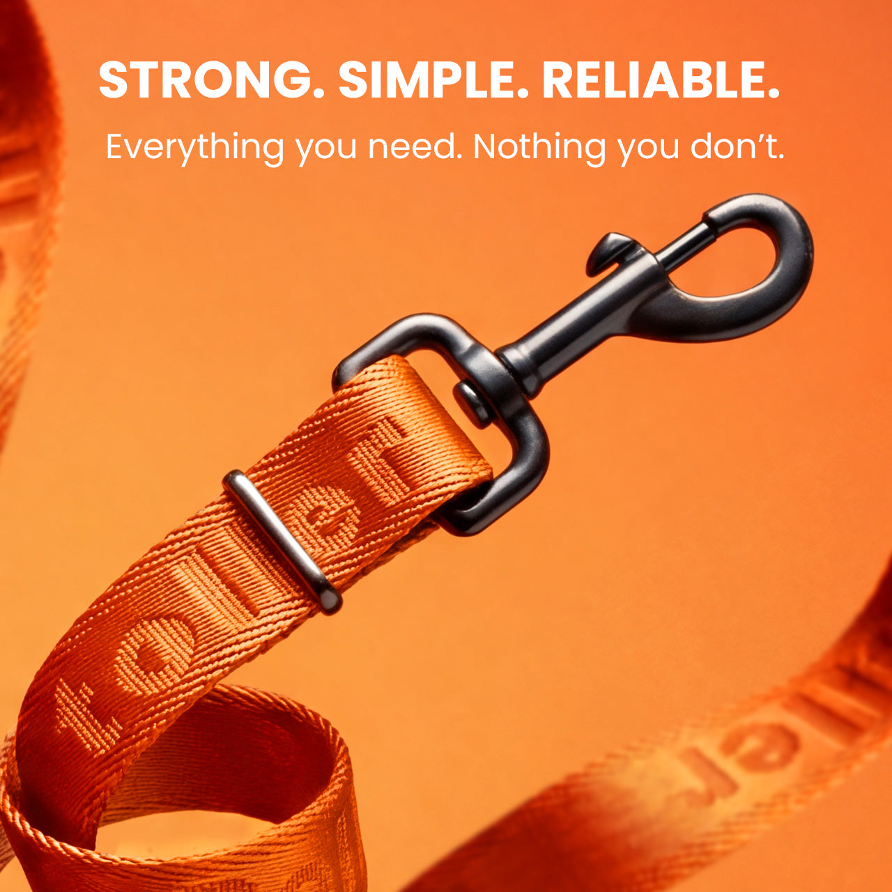 Orange dog leash with black clip on an orange background, featuring text about strength and reliability.