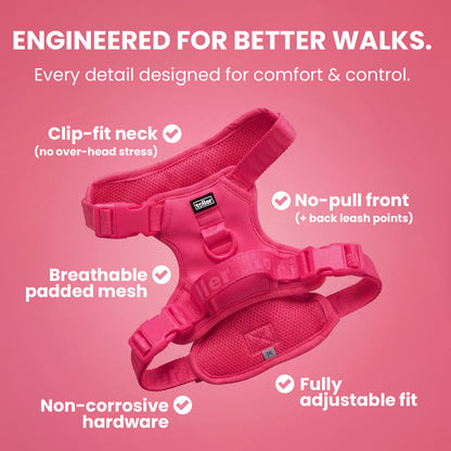 Pink dog harness with features listed on a pink background