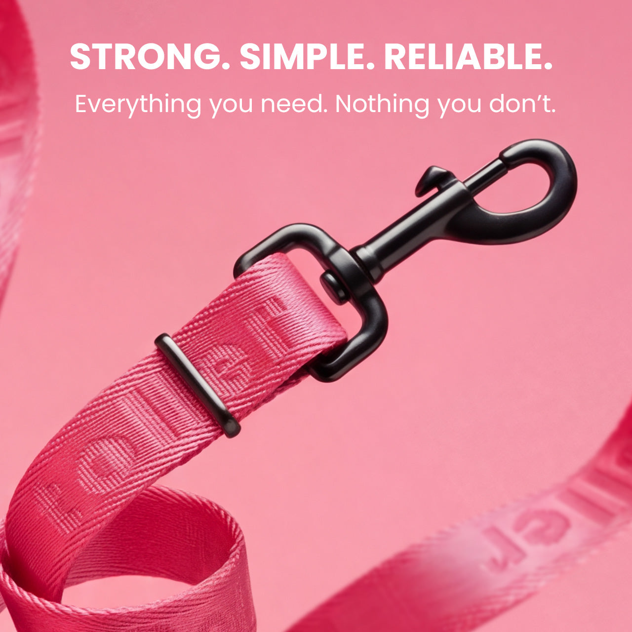 Pink dog leash with black clip on a pink background, featuring text about strength and reliability.