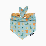 Baby bib with cartoon designs on a light blue background