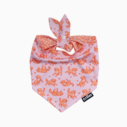Pink dog bandana with orange dog pattern on a white background