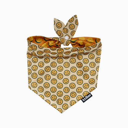 Dog bandana with smiley face pattern on a beige background