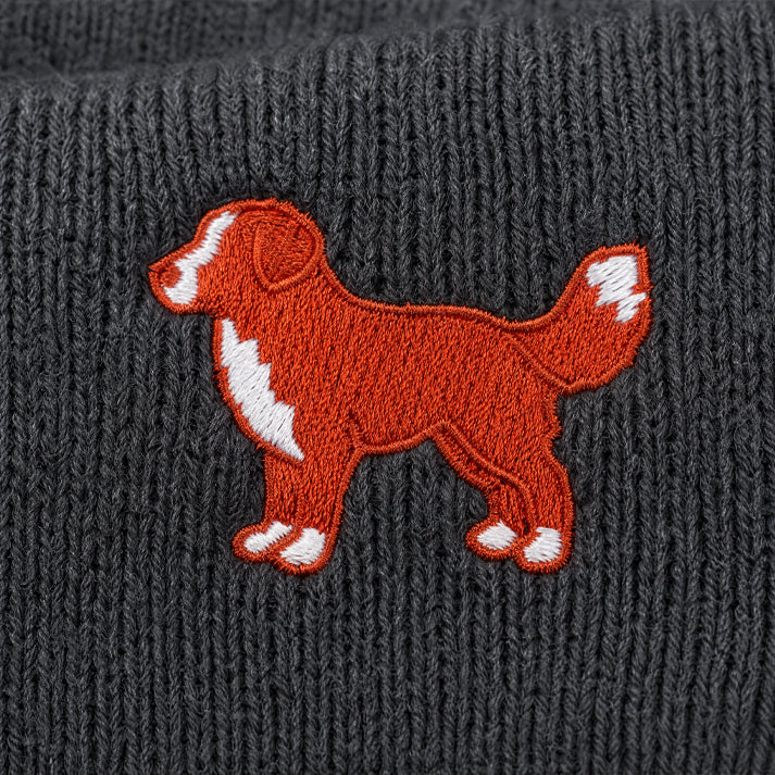 Embroidered dog design on a textured gray fabric background