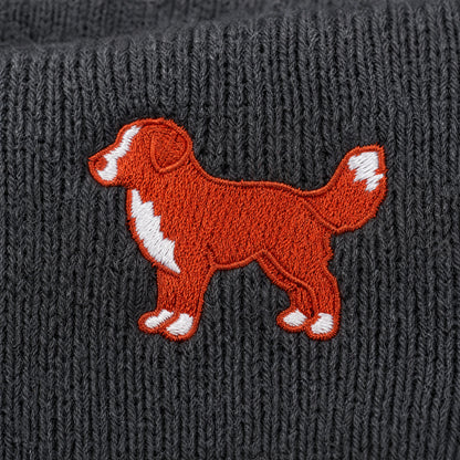 Embroidered dog design on a textured gray fabric background