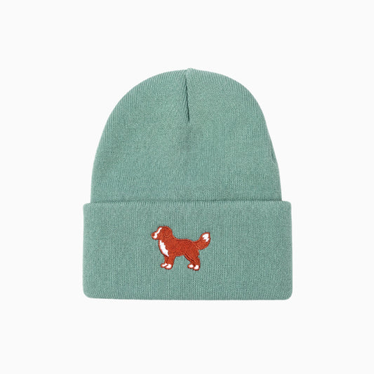 Green beanie with a red dog illustration on a white background