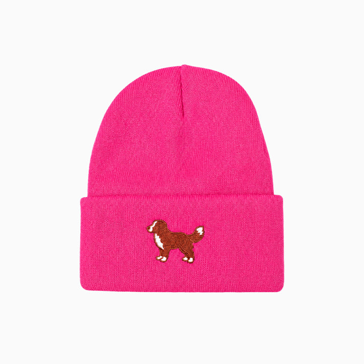 Pink beanie with a dog illustration on a white background