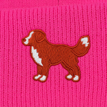 Embroidered dog design on a pink knitted fabric