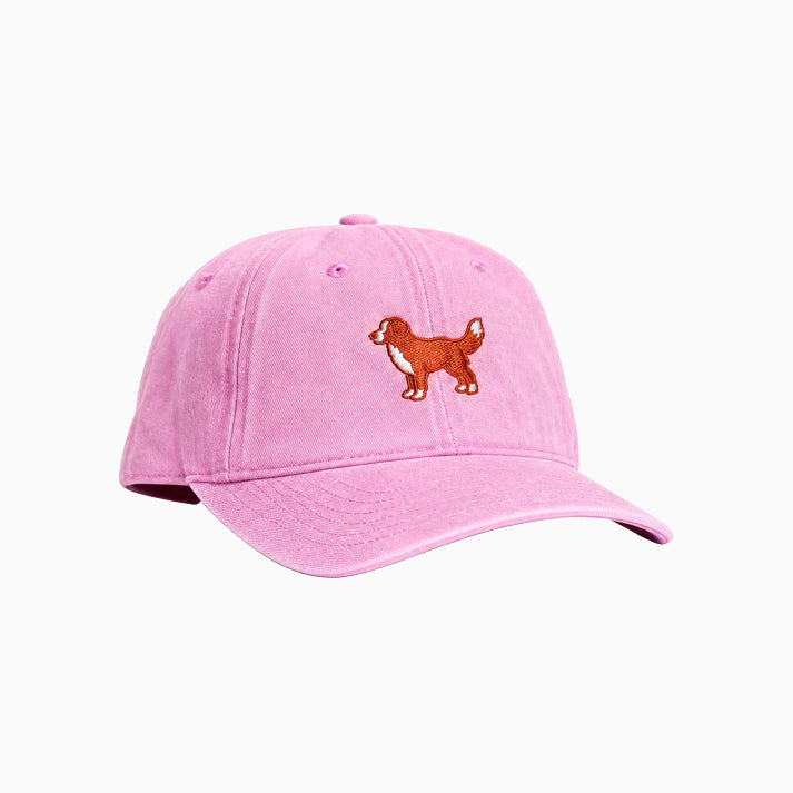 Pink cap with a dog illustration on a white background