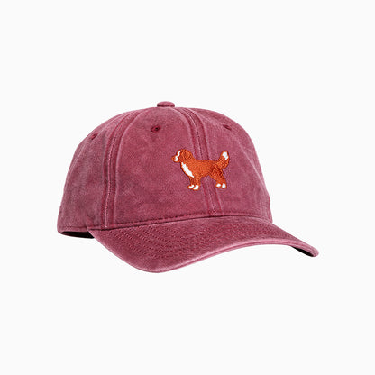 Red cap with a dog illustration on a white background