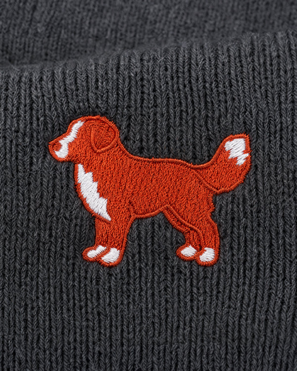 Embroidered dog design on a textured gray fabric background
