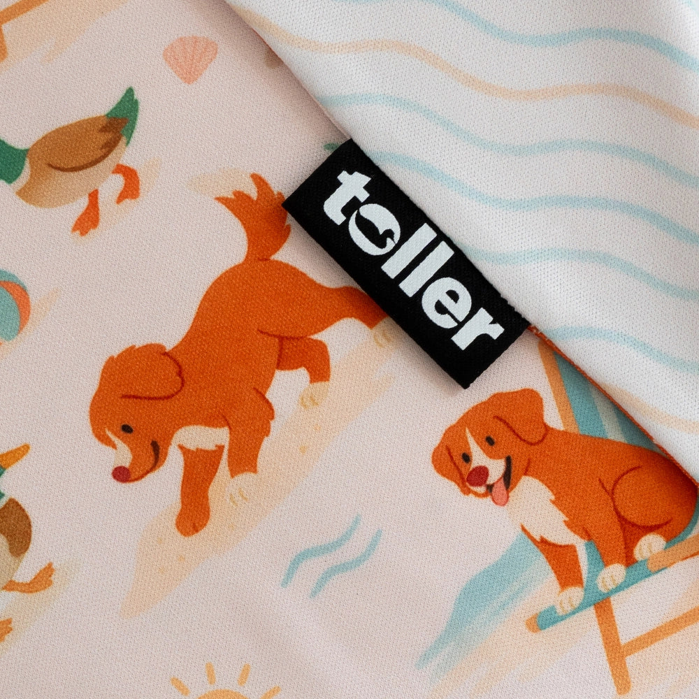 Fabric with dog pattern and 'toller' brand label